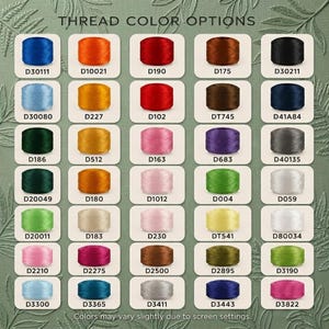 May include: A color chart titled THREAD COLOR OPTIONS displaying thirty-five individual spools of thread in various shades, each labeled with a unique alphanumeric code. The spools are arranged in a grid against a green background with leaf patterns.
