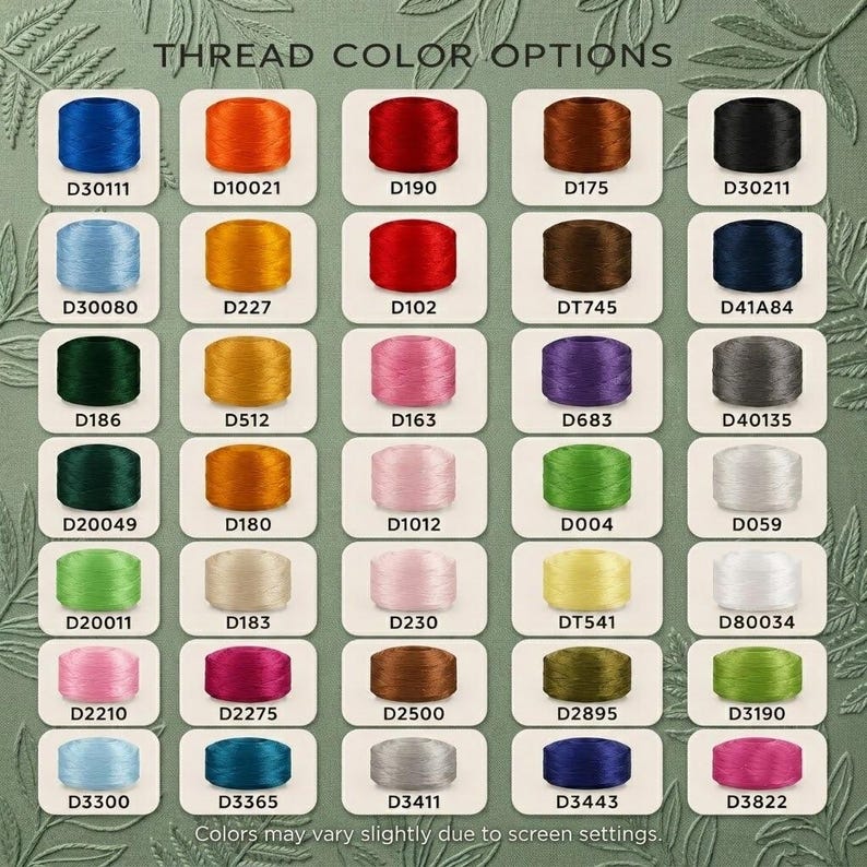 May include: A color chart titled THREAD COLOR OPTIONS displaying thirty-five individual spools of thread in various shades, each labeled with a unique alphanumeric code. The spools are arranged in a grid against a green background with leaf patterns.
