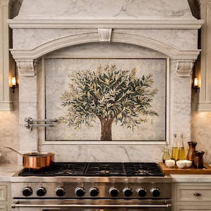 May include: A kitchen with a marble backsplash featuring a mosaic tree design. The stainless steel stove has a copper pot on top. The kitchen also has a wooden tray with small bowls and bottles of oil.