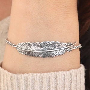 Braccialetto di piume, cavigliera di piume, finitura in argento sterling