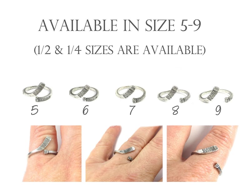 May include: Five silver rings in sizes 5 through 9, each shaped like a hockey stick. The rings are shown on a white background. The text "AVAILABLE IN SIZE 5-9 (1/2 & 1/4 SIZES ARE AVAILABLE)" is above the rings.