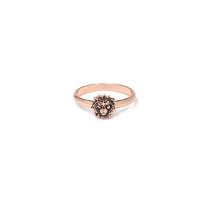 May include: A rose gold ring with a lion head design.