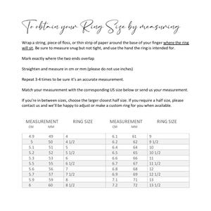 May include: A chart showing ring sizes in US sizes, centimeters, and millimeters. The chart includes instructions on how to measure your ring size using a string, piece of floss, or thin strip of paper.