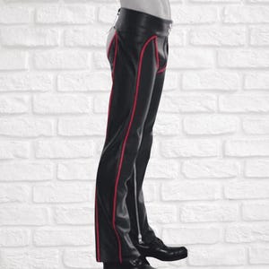 Men’s black leather chaps with red piping,
Genuine real leather fetish chaps for men,
Open crotch biker leather chaps for men,
Premium quality men’s leather fetish pants,
Real leather chaps for parties and nightlife,
Bold men’s fetish leather trousers with piping,
Men’s open crotch leather pants for clubwear,
Fetish wear men,
Leather clubwear men,
Fetish wear men,
Rocker style leather chaps,
Nightlife fetish leather pants,
Exotic leather chaps men,
Premium fetish leather trousers