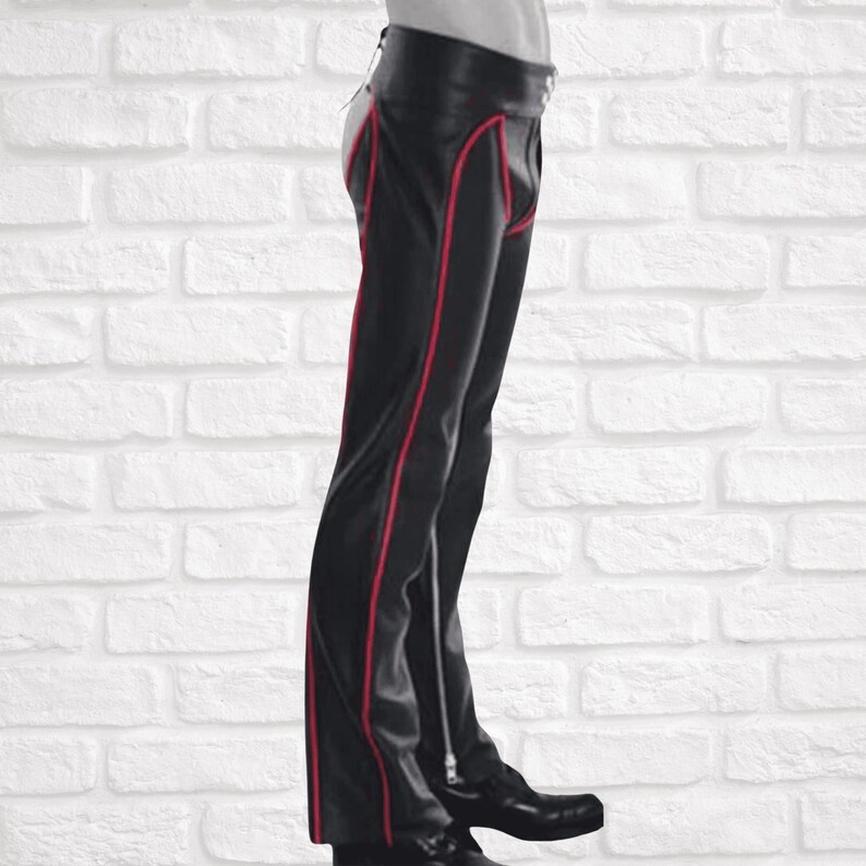 Men’s black leather chaps with red piping,
Genuine real leather fetish chaps for men,
Open crotch biker leather chaps for men,
Premium quality men’s leather fetish pants,
Real leather chaps for parties and nightlife,
Bold men’s fetish leather trousers with piping,
Men’s open crotch leather pants for clubwear,
Fetish wear men,
Leather clubwear men,
Fetish wear men,
Rocker style leather chaps,
Nightlife fetish leather pants,
Exotic leather chaps men,
Premium fetish leather trousers