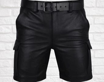 May include: Black leather cargo shorts with a black belt. The shorts have two large pockets on the sides.