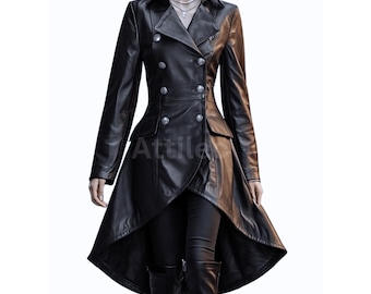 May include: A black leather coat with a double-breasted design, featuring silver buttons and a unique asymmetrical hemline. The coat has a classic collar and long sleeves. The brand name "Attila" is visible on the coat.
