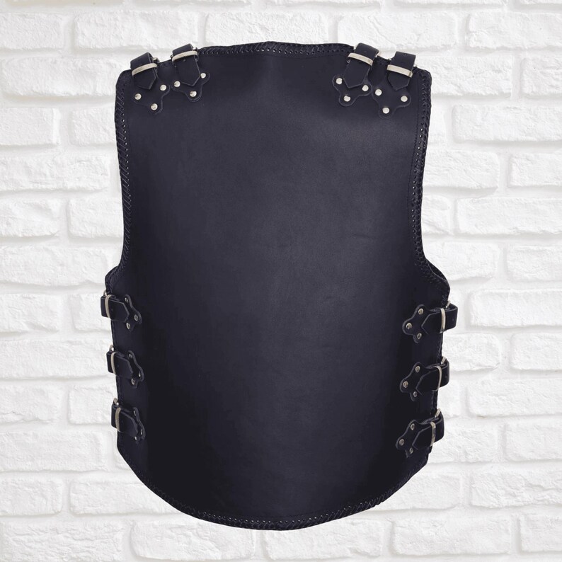 Back view of men’s black leather biker vest with clean panel for patches