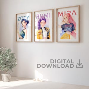 May include: Three framed watercolor prints featuring stylized portraits of women named Zoey, Rumi, and Mira. Each print has a light wood frame and is displayed on a white wall. The text "DIGITAL DOWNLOAD" is below the prints.
