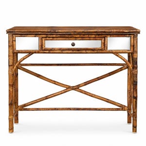May include: A bamboo console table with a rectangular top and a single drawer. The drawer and side panels feature mirrored surfaces. The table has a natural brown finish and a decorative X-shaped support.