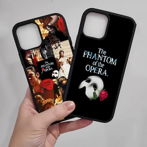 May include: Two black phone cases featuring designs from "The Phantom of the Opera." One case has a collage of images and the text "The Phantom of the Opera." The other case has the title text, a white mask, and a red rose.