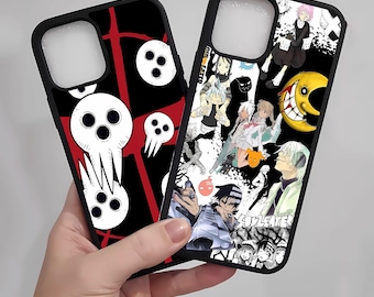 May include: Two black phone cases with unique designs. One features a white skull with three eye holes on a black and red background. The other case displays various anime characters and a yellow crescent moon on a white and black background.