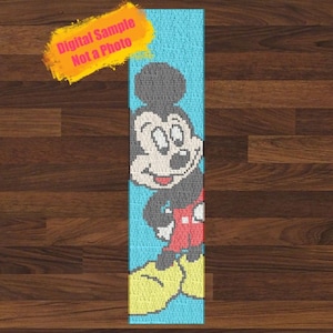 May include: A blue and yellow rug with a pixelated image of Mickey Mouse. The rug is on a wood floor. Digital Sample Not a Photo.