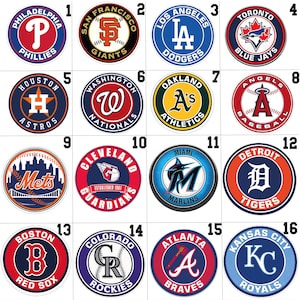 May include: A collection of sixteen circular Major League Baseball team logo stickers arranged in a four-by-four grid. Each sticker features a unique team name, colour scheme, and graphic emblem, including the Phillies, Giants, Dodgers, Blue Jays, Astros, Nationals, Athletics, Angels, Mets, Guardians, Marlins, Tigers, Red Sox, Rockies, Braves, and Royals.