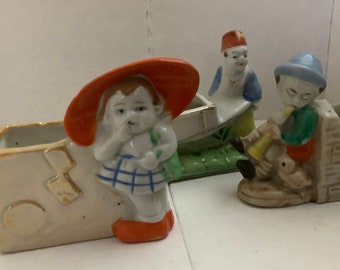 Two Vintage Made in Japan Figurines and one Occupied Japan Little Planters Two Pushing Carts One with Tiny Ducky Three in Total