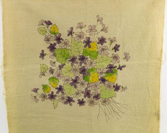 May include: A hand-painted floral design on a light beige fabric. The artwork features a bouquet of purple flowers, green and yellow leaves, and delicate black outlines. The text "C 2042" is visible in the bottom corner. The fabric has a slightly wrinkled texture.