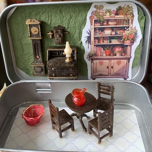 May include: Miniature dollhouse furniture and accessories arranged inside a metal tin. Includes a grandfather clock, desk, table, chairs, a red pitcher, and a red basket. A sticker of a cabinet with plants is also included.
