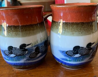 Pair of Pottery Signed Loon Coffee Mugs