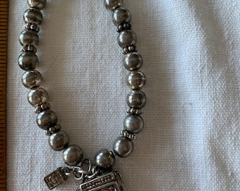 Faux Silver Bead Stretch Bracelet with Treasure Chest Charm that opens and a Tiny Chest Charm That Doesn’t Open