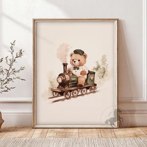 May include: A watercolor illustration of a teddy bear wearing a green cap and driving a green toy train. The train is on a track and there are trees in the background.