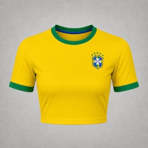 Front product mockup of a yellow Brazil-inspired football crop top with green collar, sleeve cuffs and chest crest