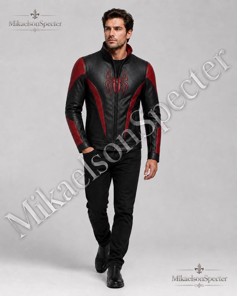 Male model wearing MikaelsonSpecter black and red spider inspired leather jacket, front view with premium biker style and bold chest emblem.