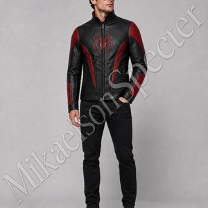 Full body male model wearing black and red spider inspired leather jacket with sleek biker fit, premium finish, and bold front emblem