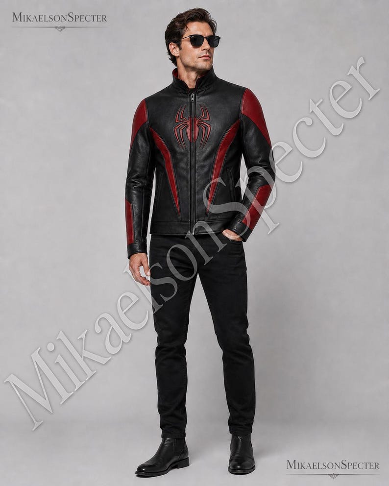 Full body male model wearing black and red spider inspired leather jacket with sleek biker fit, premium finish, and bold front emblem