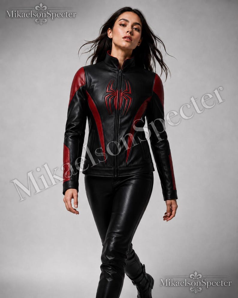Female model walking in MikaelsonSpecter black and red spider inspired leather jacket with premium biker styling and bold fashion look