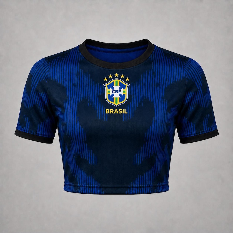 Front product mockup of a navy Brazil-inspired away football crop top with blue pattern, black trim and centered crest