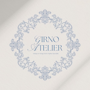 May include: A blue and white logo design featuring the text "GIRNO ATELIER" within a decorative, ornate frame. The text "Antique & Vintage Style Graphics Specialist" is below the main text. The design is set against a textured, off-white background.