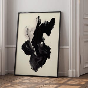 May include: Black and white abstract painting in a black frame. The painting features a large, swirling black shape on a white background.
