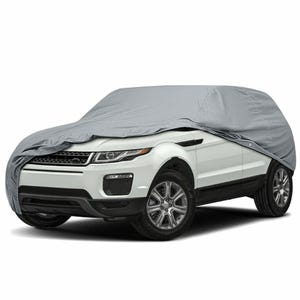 May include: A light gray car cover draped over a white SUV. The cover is fitted to the vehicle's shape, protecting the car from the elements. The SUV has black tires and silver rims.
