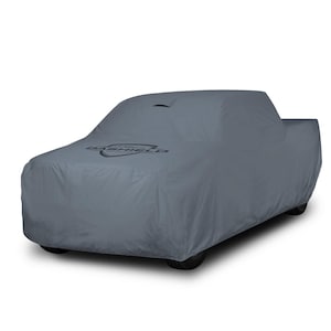 May include: A gray car cover draped over a pickup truck. The cover has the word "DASHIELD" printed on the front. The cover is designed to protect the vehicle from the elements.