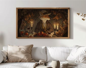 May include: A framed print shows a fox in a suit and hat, seated at a table with candles, fruit, and wine. The artwork has a warm colour palette with autumn leaves and a vintage aesthetic. The fox is the central figure in the image.