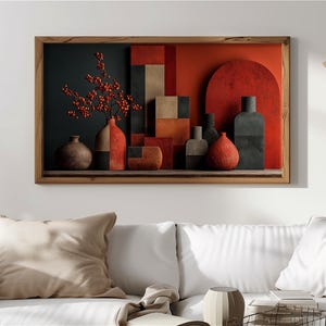 Pode incluir: Obra de arte abstrata emoldurada com uma composição de natureza morta. A obra apresenta uma coleção de vasos e formas geométricas em tons de vermelho, castanho e cinza. Uma prateleira e uma moldura de madeira completam o design, criando uma estética moderna.