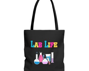 May include: Black tote bag with the text "LAB LIFE" in colourful letters. The bag features a graphic of five colourful beakers and a graduated cylinder.