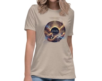 May include: A beige women's t-shirt featuring a graphic print of a record with a galaxy design. The text on the record reads "Feel the Vibe Hear the Music".