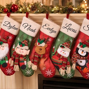 May include: Five Christmas stockings with white faux fur cuffs, each personalised with the names Dylan, Noah, Evelyn, Lucas, and Stella. The stockings feature festive characters including Santa, an elf, a reindeer, a snowman, and a penguin.