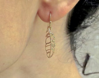 Gold feather earrings