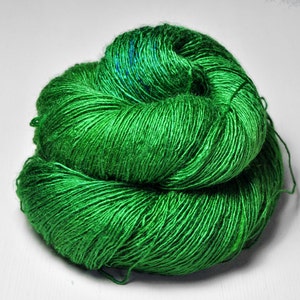 May include: A skein of bright green yarn, perfect for knitting or crocheting.