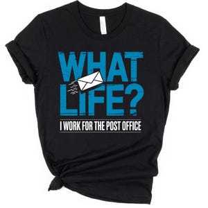 May include: Black t-shirt with the text "WHAT LIFE? I WORK FOR THE POST OFFICE" in distressed blue lettering. A white envelope graphic is featured above the text, with lines indicating motion.