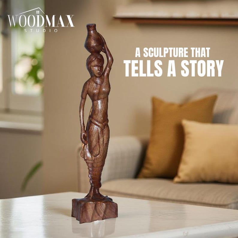 May include: A brown wooden sculpture of a woman carrying a jug on her head. The sculpture is on a square base and is set on a white table. The text on the image reads: "A SCULPTURE THAT TELLS A STORY."