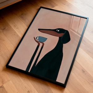 May include: A framed rectangular wall art print featuring a stylized illustration of a black and brown dog with long limbs holding a small light blue cup. The dog has a long snout and is set against a solid muted pink background within a thin black frame.