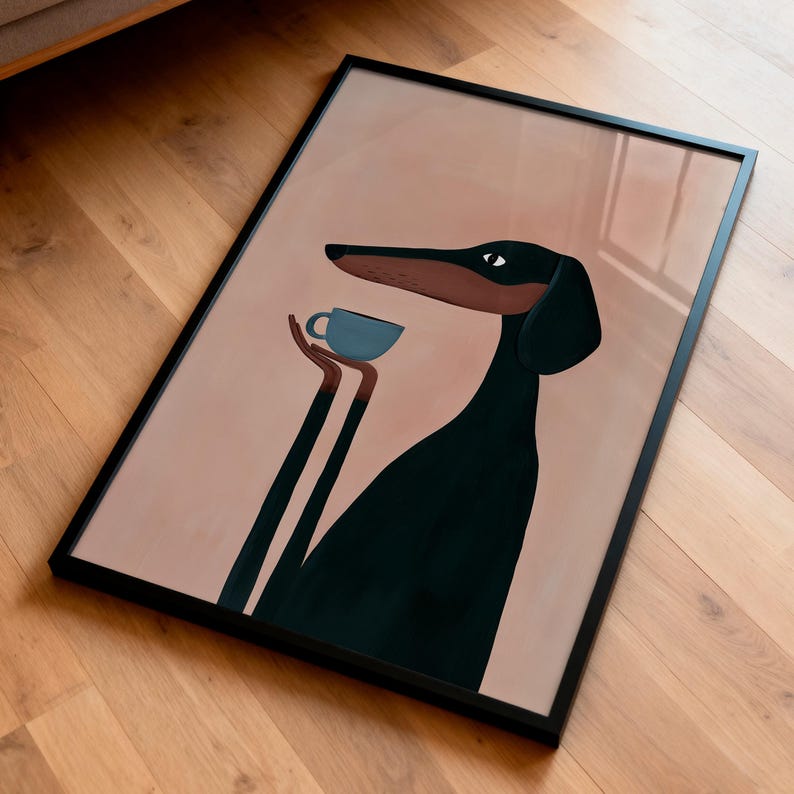 May include: A framed rectangular wall art print featuring a stylized illustration of a black and brown dog with long limbs holding a small light blue cup. The dog has a long snout and is set against a solid muted pink background within a thin black frame.