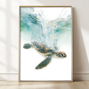 May include: A framed art print depicting a sea turtle underwater. The turtle has a patterned shell and flippers, with water splashing above. The artwork is set against a white background, framed in gold.