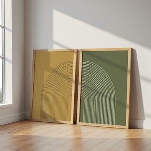 May include: Two rectangular framed wall art prints featuring a series of thin, concentric arch lines. One print has a mustard yellow background with black lines, while the other has an olive green background with white lines in wooden frames.