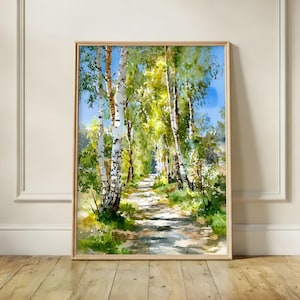 May include: Watercolour painting of a forest path in a light wood frame. The artwork depicts a path winding through birch trees with white bark and green leaves. The sky is blue, and the scene is filled with light and shadow.