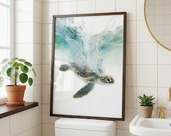 May include: A framed wall art print featuring a sea turtle swimming underwater with a splash of turquoise and white bubbles above it. The turtle has a patterned shell in shades of brown, tan, and green, with flippers extended in motion.
