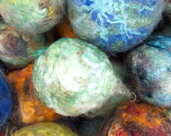 May include: A collection of colorful felted balls, each with a unique pattern and texture. The balls are made of wool and are soft and fluffy. They are perfect for adding a touch of whimsy to any room.